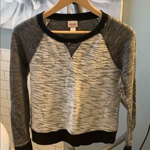 Black, white, and grey sweatshirt